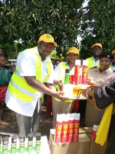 Dr. Omerikwa donating insecticides and other drugs to the residents at the Kwale County jigger clinic.