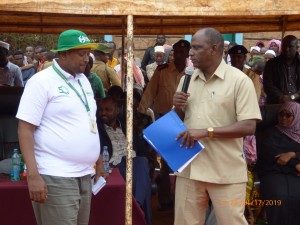 Labour C.S Amb. Ukur Yatani with NSSF Branch Manager in Wajir County during the Labour Ministry outreach programme on Social Security. 